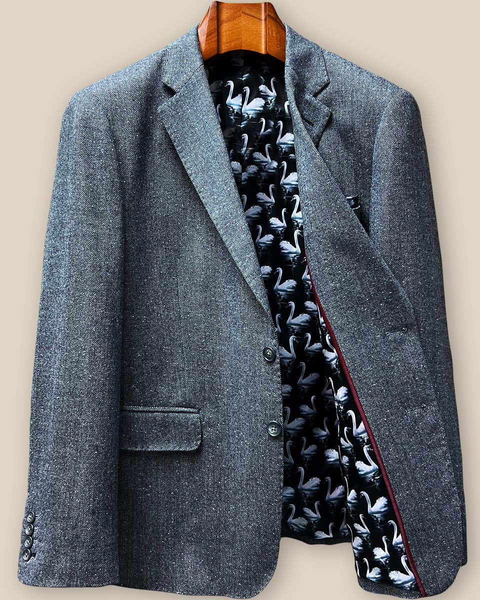 Interior left panel view revealing black swan-patterned lining with luxurious maroon piping detail along the seam