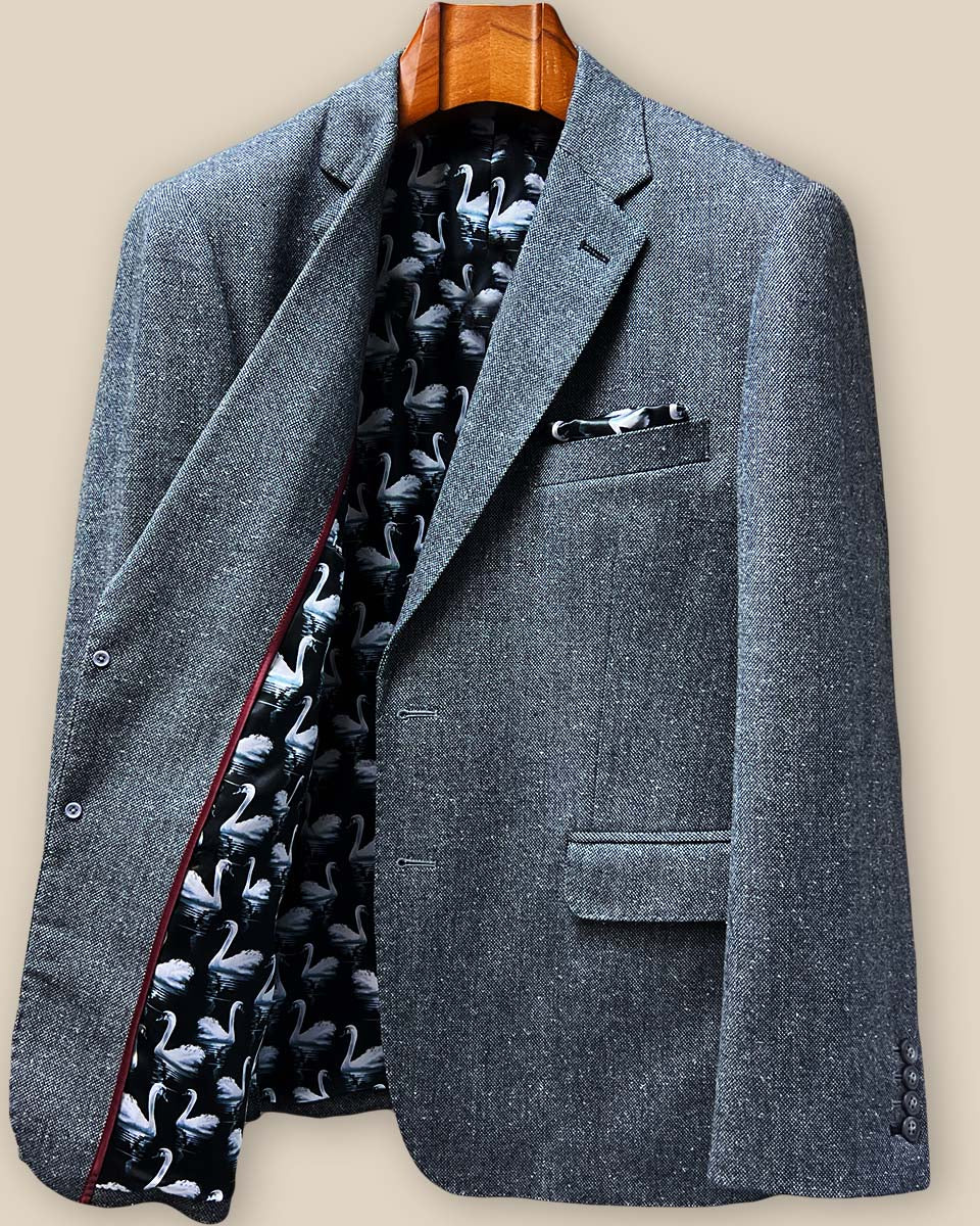 Interior right panel view showing pocket construction and swan-patterned lining with maroon piping detail