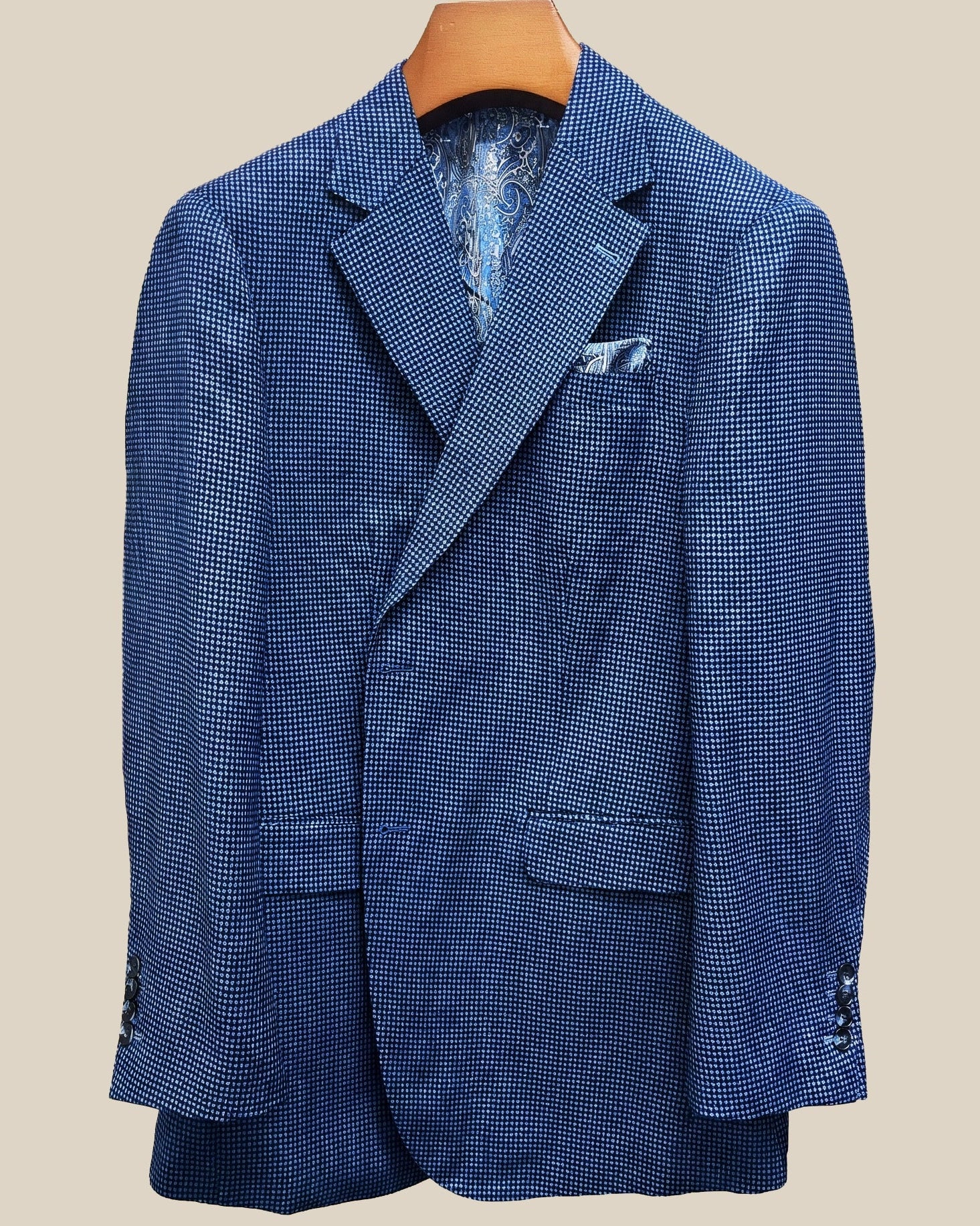 Close-up view of medium blue micro check sport coat showing contrast light blue accent buttonhole with hand-finished stitching detail