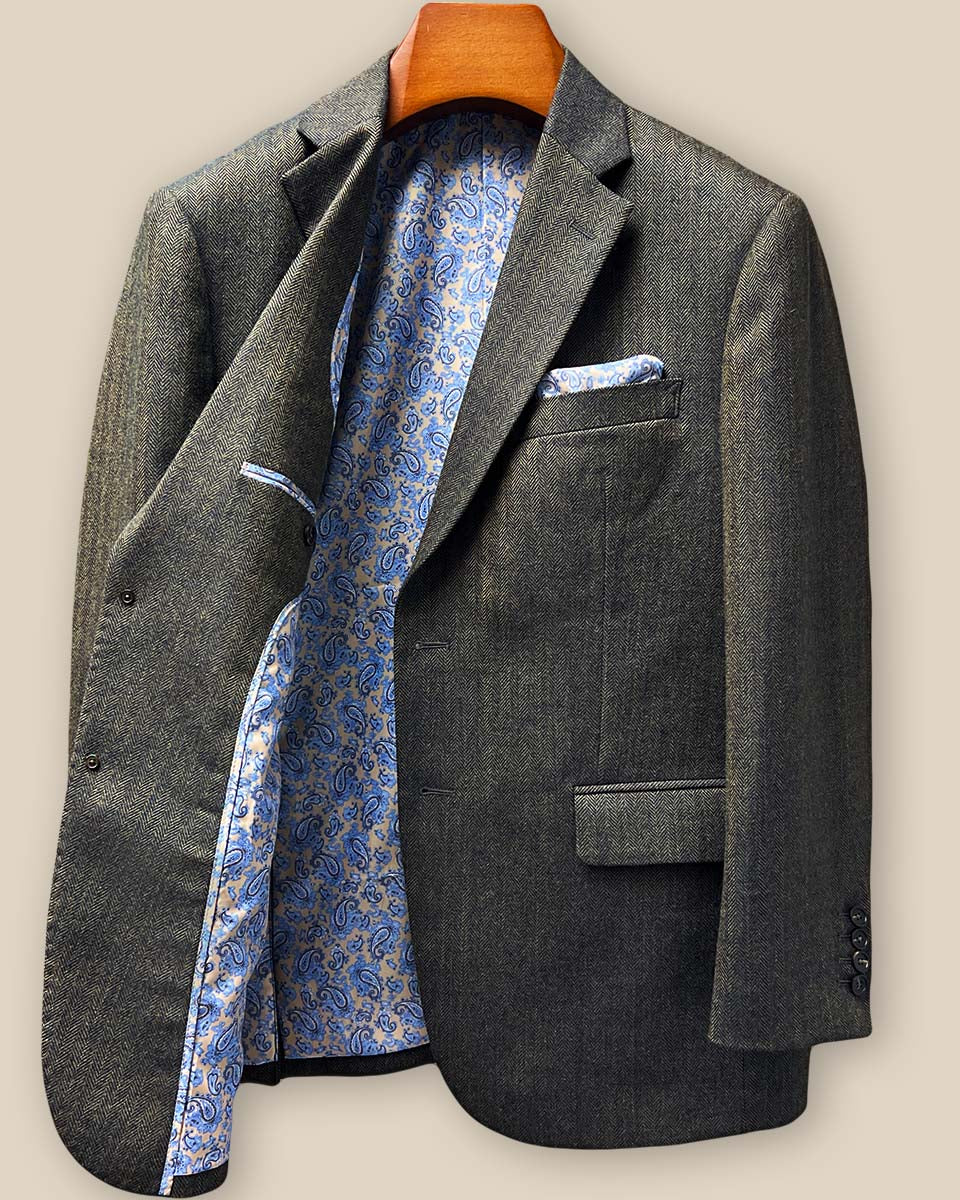 Interior right side detail revealing inner pockets, construction quality, and paisley lining craftsmanship with pen holder feature