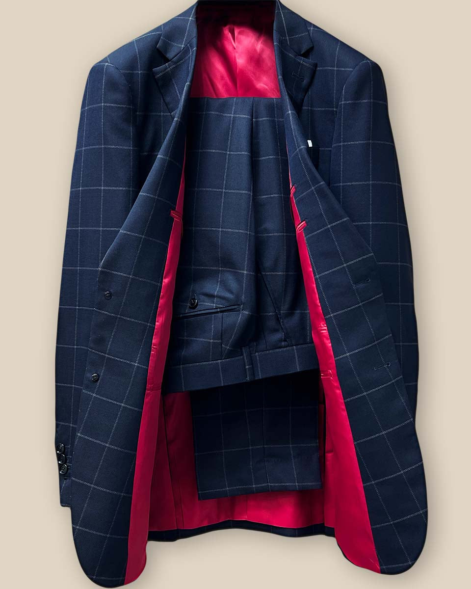 Front view of complete two-piece navy suit with white windowpane pattern