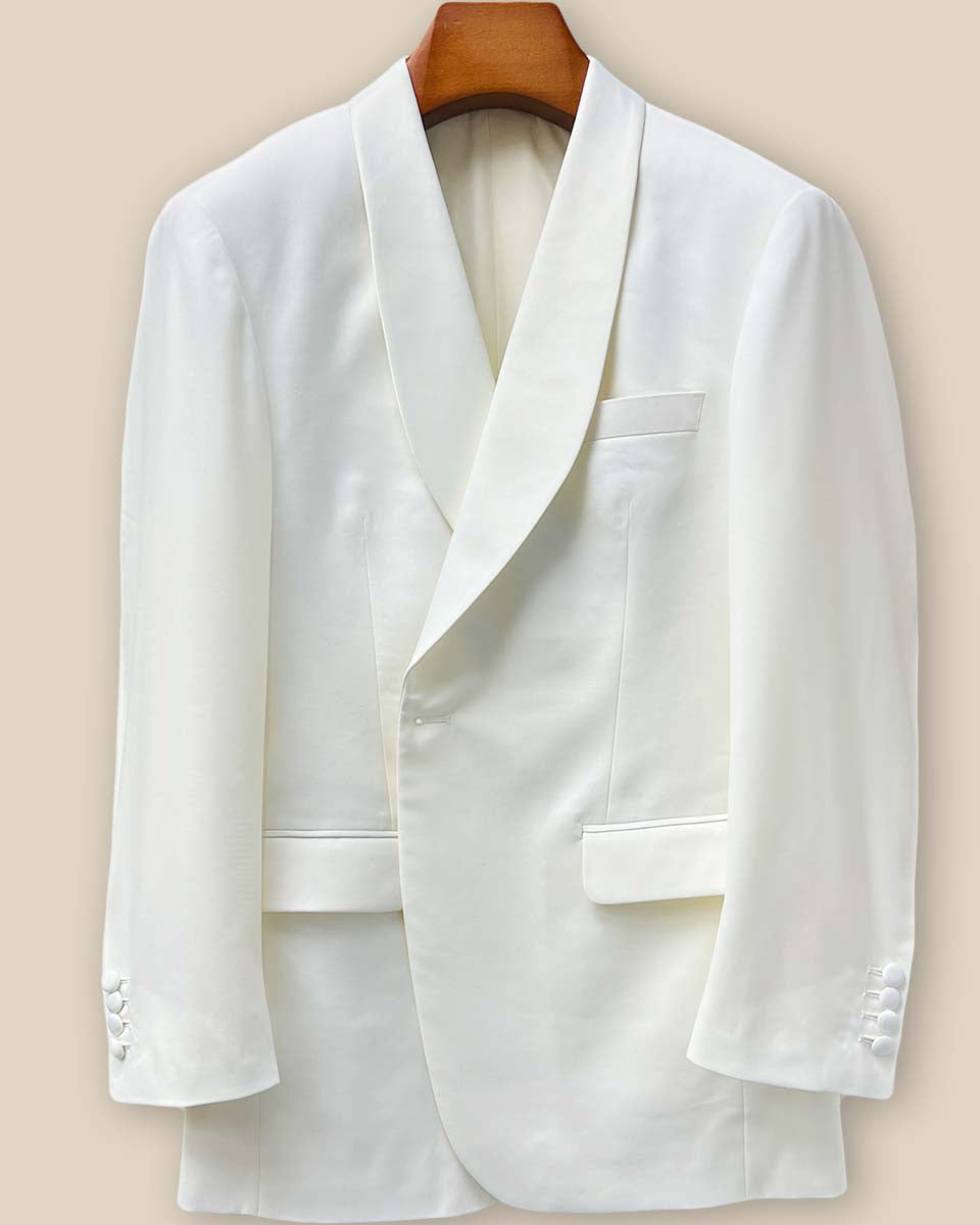 Close-up view of the off-white Westwood Hart dinner jacket showing detailed buttonhole stitching on the front panel, highlighting the Super 130's Australian merino wool quality