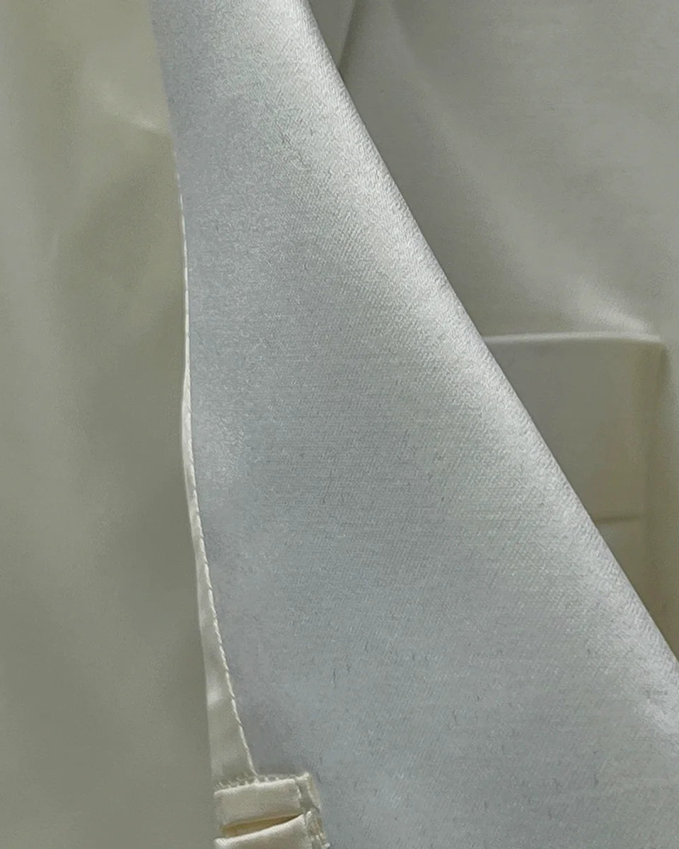 Close-up texture detail of the premium off-white bemberg silk lining used in the Westwood Hart dinner jacket, highlighting its smooth finish and breathability
