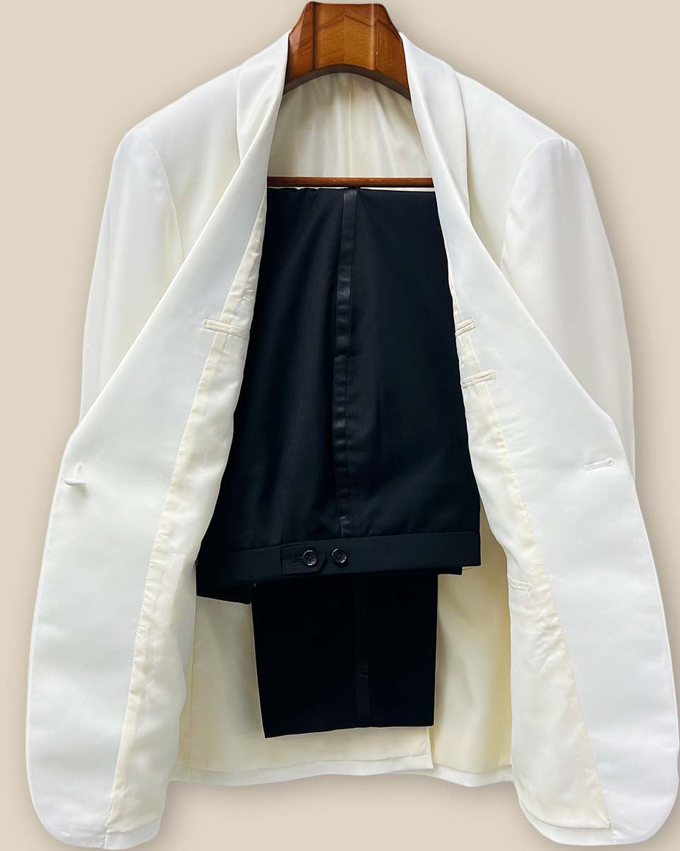 Front view of the complete Westwood Hart two-piece tuxedo featuring the off-white dinner jacket with silk satin shawl lapel paired with classic black tuxedo pants with satin trim