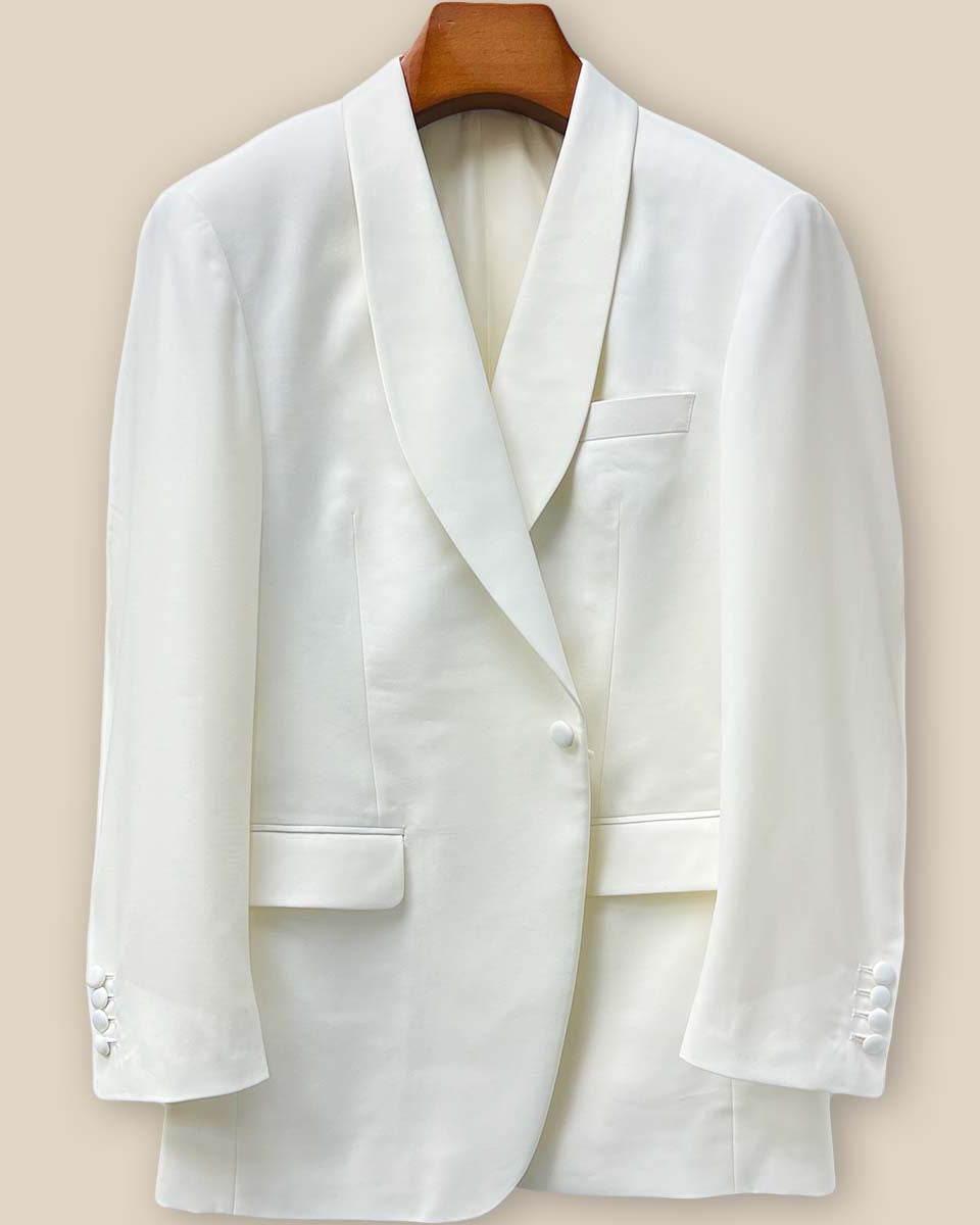 Close-up of the Westwood Hart dinner jacket's front button panel featuring elegant off-white silk satin covered buttons against the Super 130's Australian merino wool
