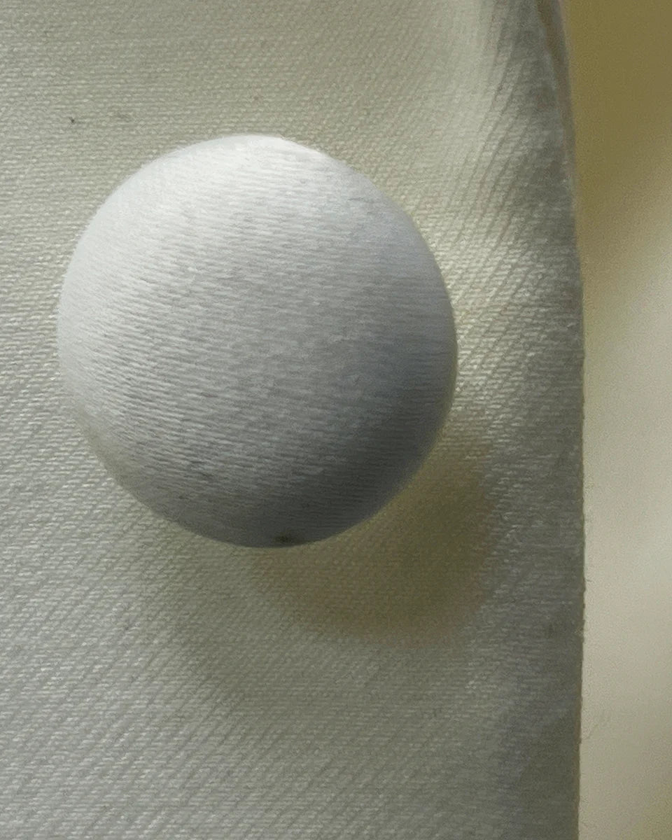 Styled shot of the Westwood Hart off-white dinner jacket tuxedo silk satin covered button