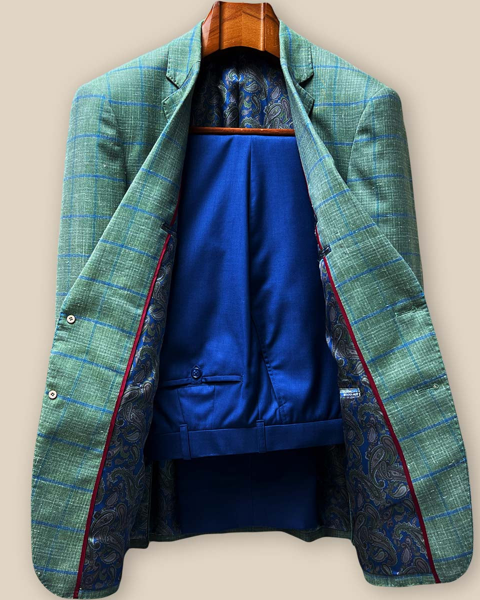 lete two-piece ensemble featuring olive green windowpane sport coat paired with matching cobalt blue plain weave trousers on model