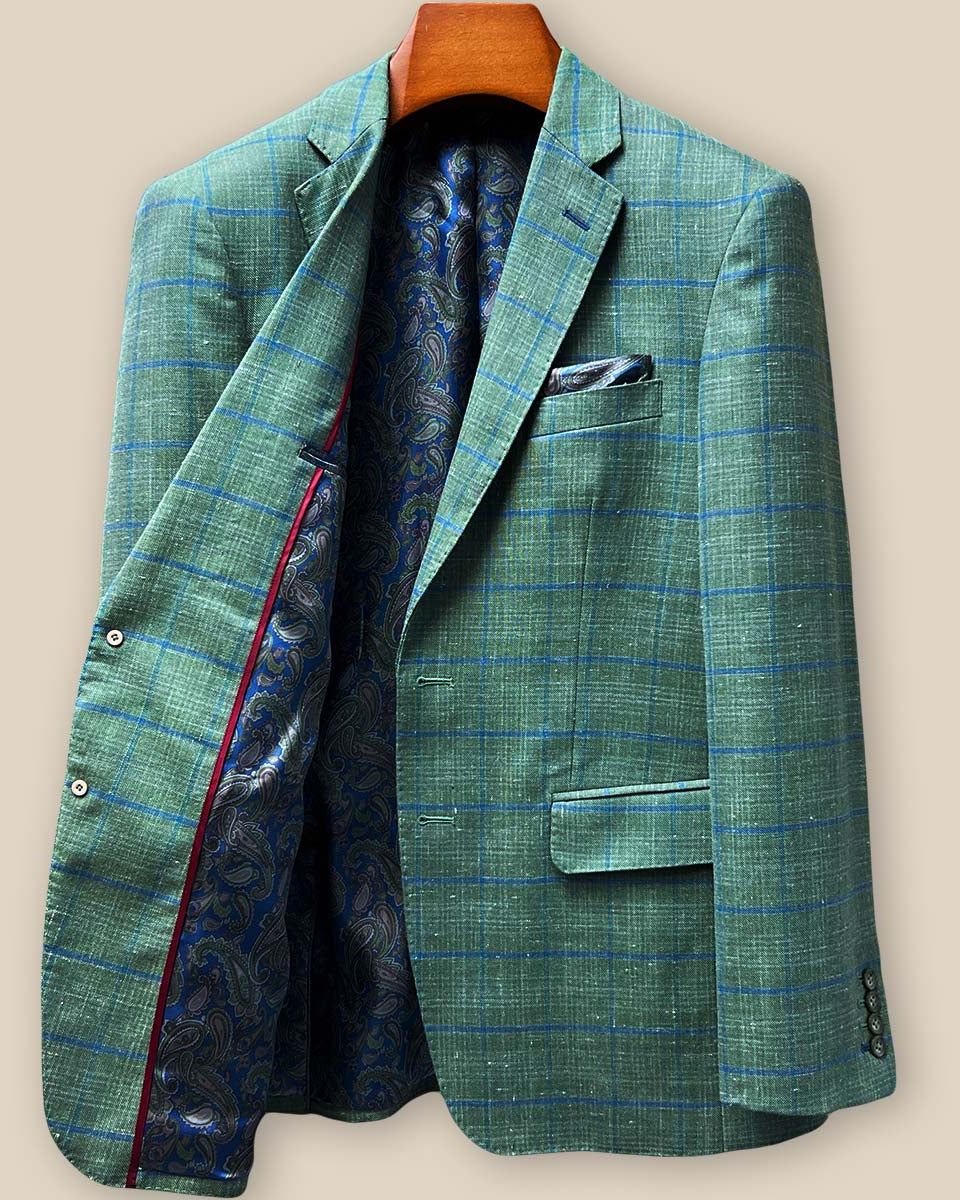 Right interior panel showcasing blue paisley lining, maroon contrast piping, and internal pocket configuration with expert construction details