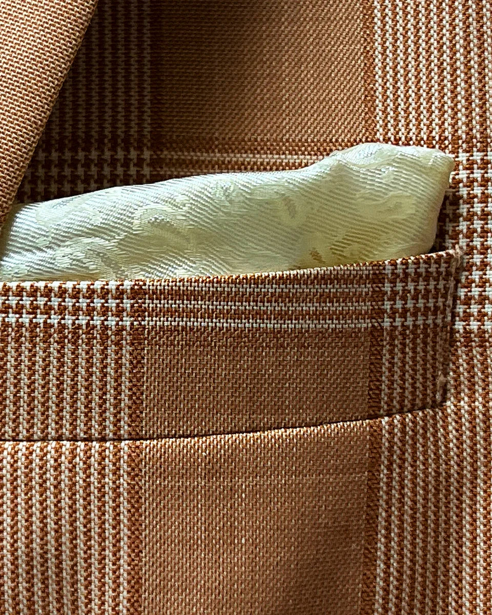 Close-up of jacket breast pocket with coordinating built-in pocket square