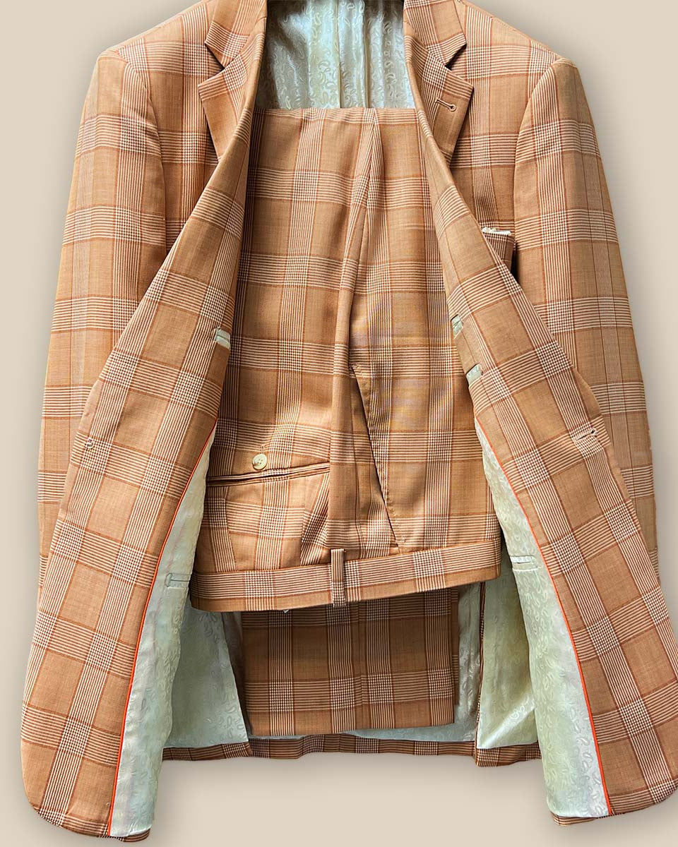 Front view of orange Prince of Wales glen plaid two-piece suit with one-button jacket and matching trousers