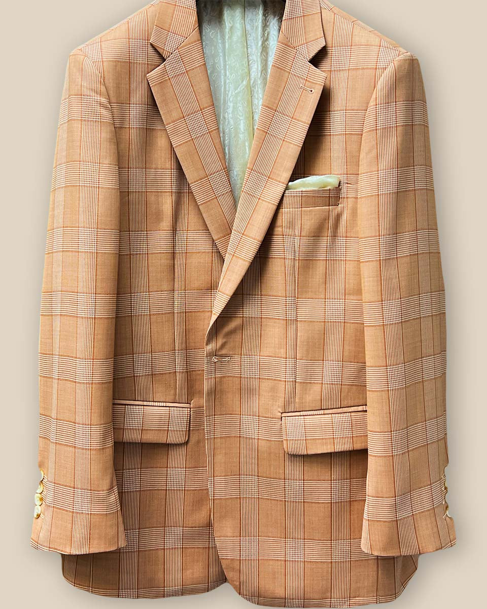 Close-up of orange Prince of Wales glen plaid suit jacket showing single button closure and buttonhole detail
