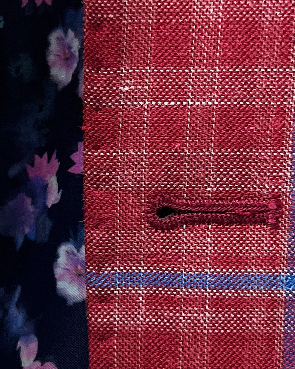 Close-up view of the sport coat's buttonhole stitching, showcasing the hand-stitched matching pick stitching detail.