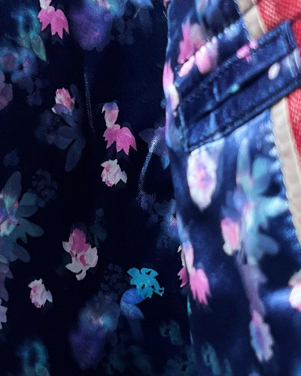 Interior view of the sport coat, highlighting the flash linings with pink and blue floral accents against the navy base.