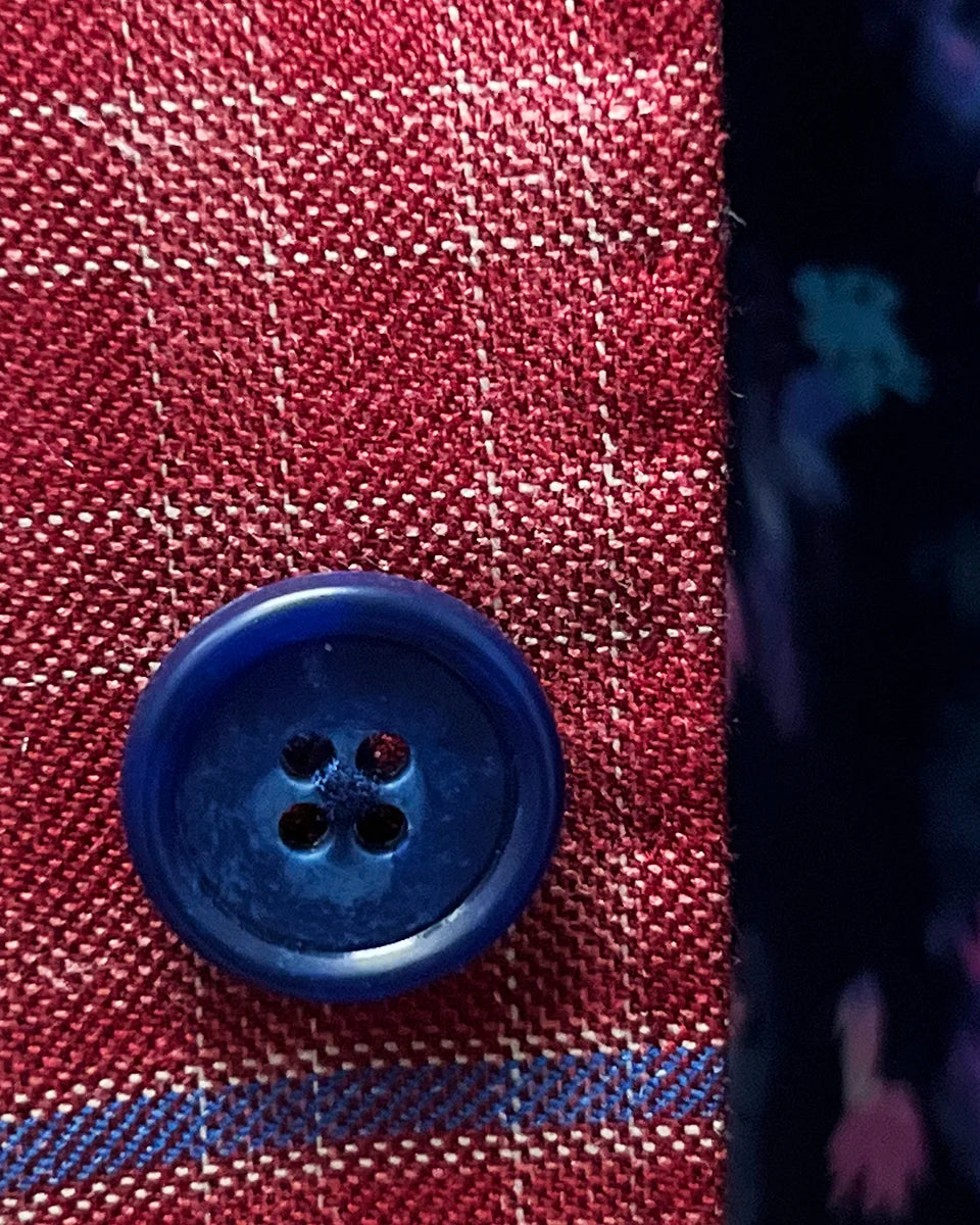 Detailed view of the sport coat's navy marble horn buttons, adding a sophisticated touch to the design.