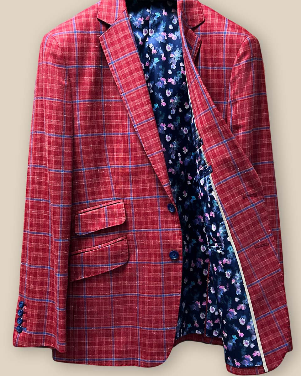 Inside left view of the sport coat, highlighting the navy lining with pink and blue floral accents.