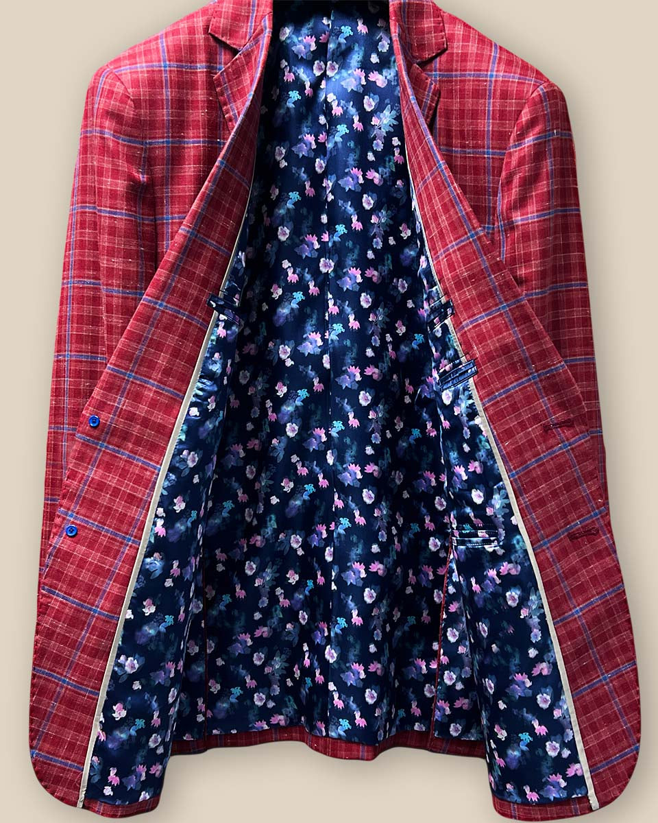 Full inside lining view of the sport coat, showcasing the navy lining with pink and blue floral accents and the impeccable craftsmanship.