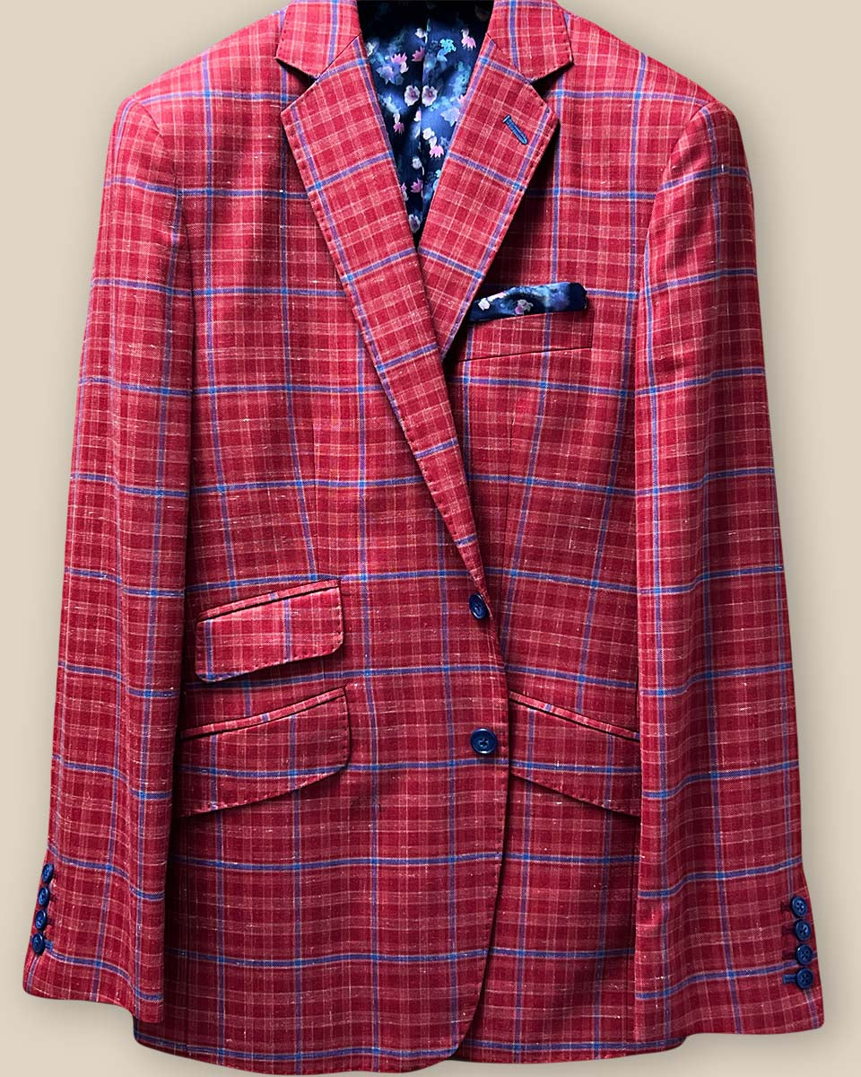 Detailed view of the sport coat's front button panel, featuring navy marble horn buttons and matching hand-stitched pick stitching.