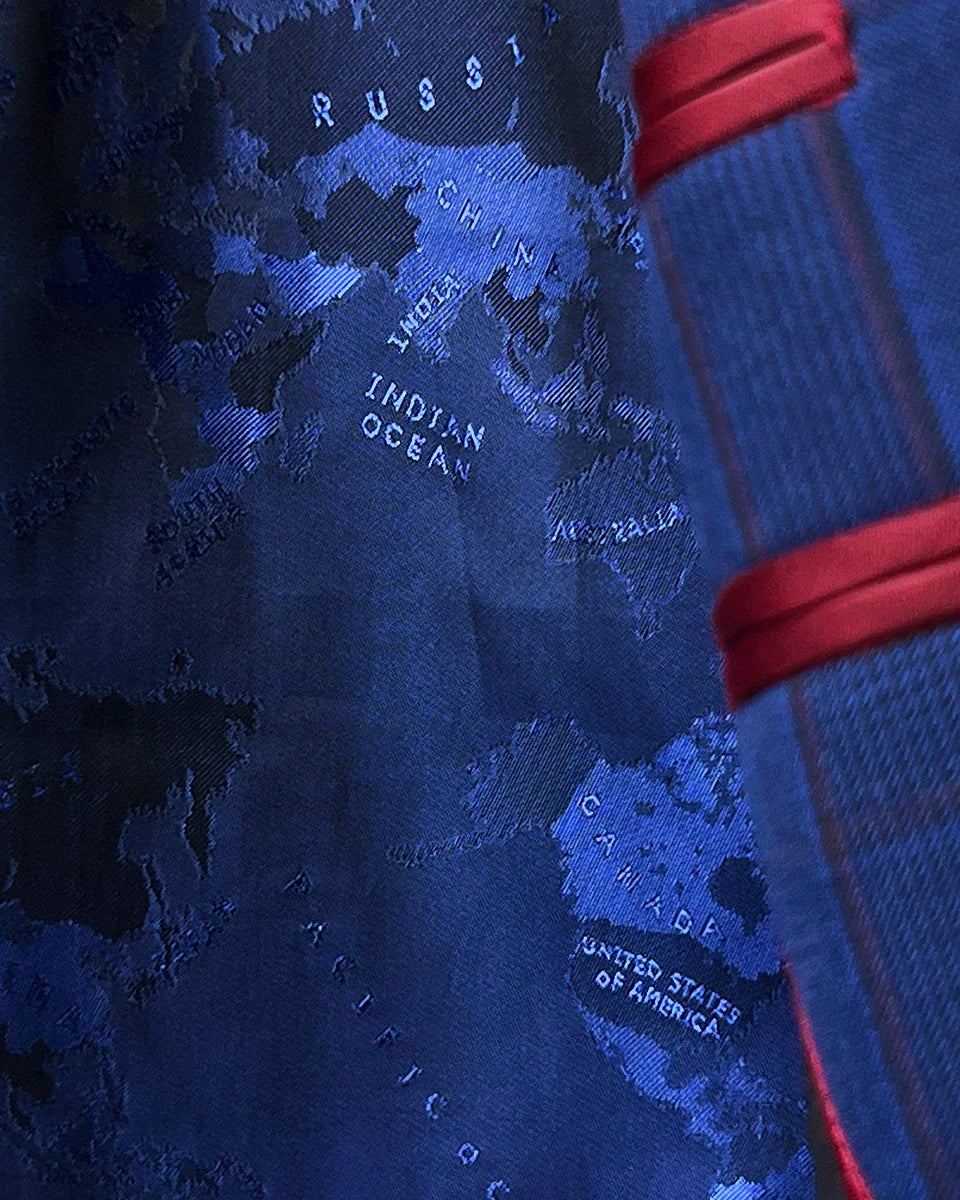Vibrant navy world geography map flash lining detail creating striking contrast with royal blue exterior fabric