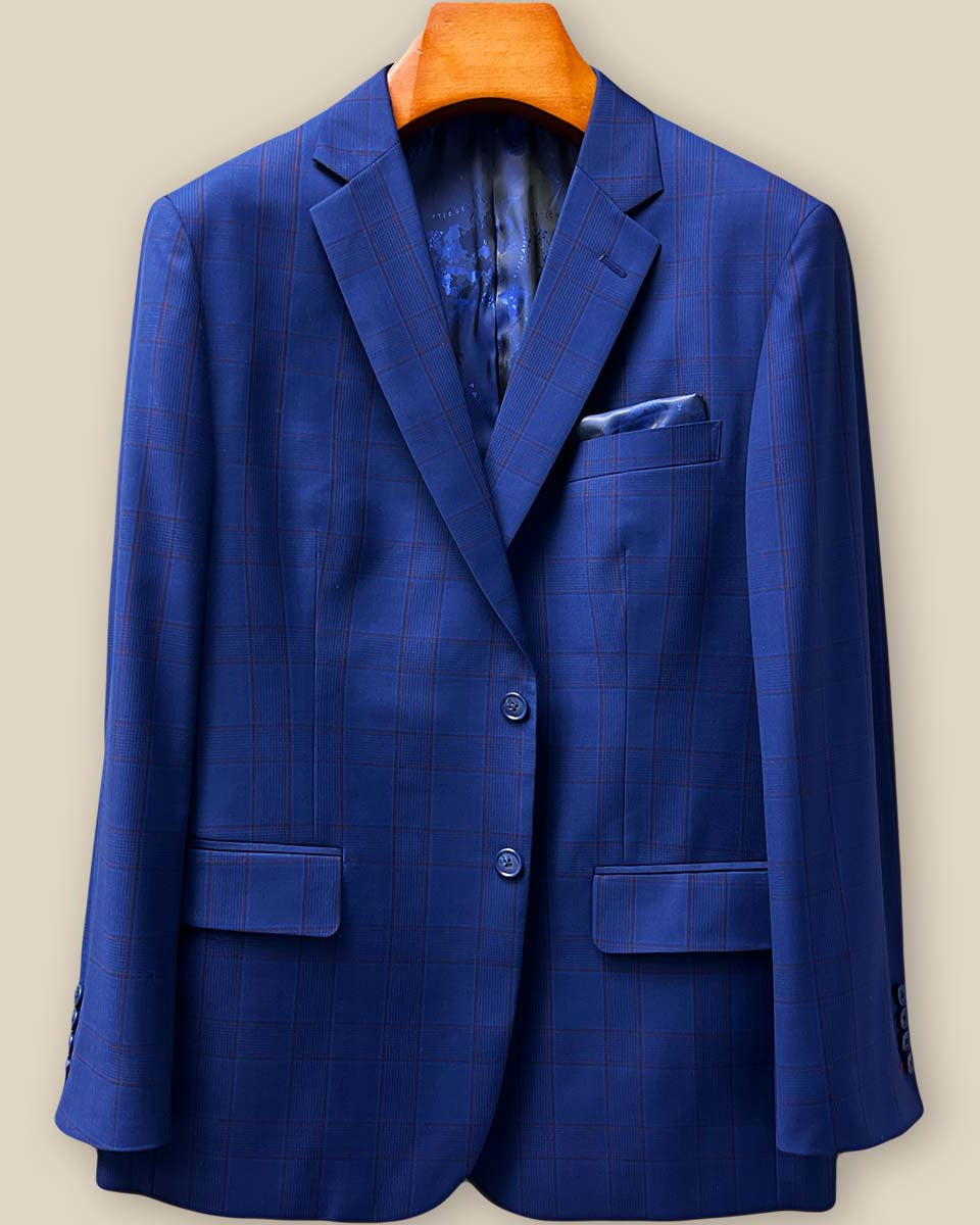 Front button panel view highlighting navy marble horn buttons against the rich Prince of Wales plaid fabric with expert tailoring details