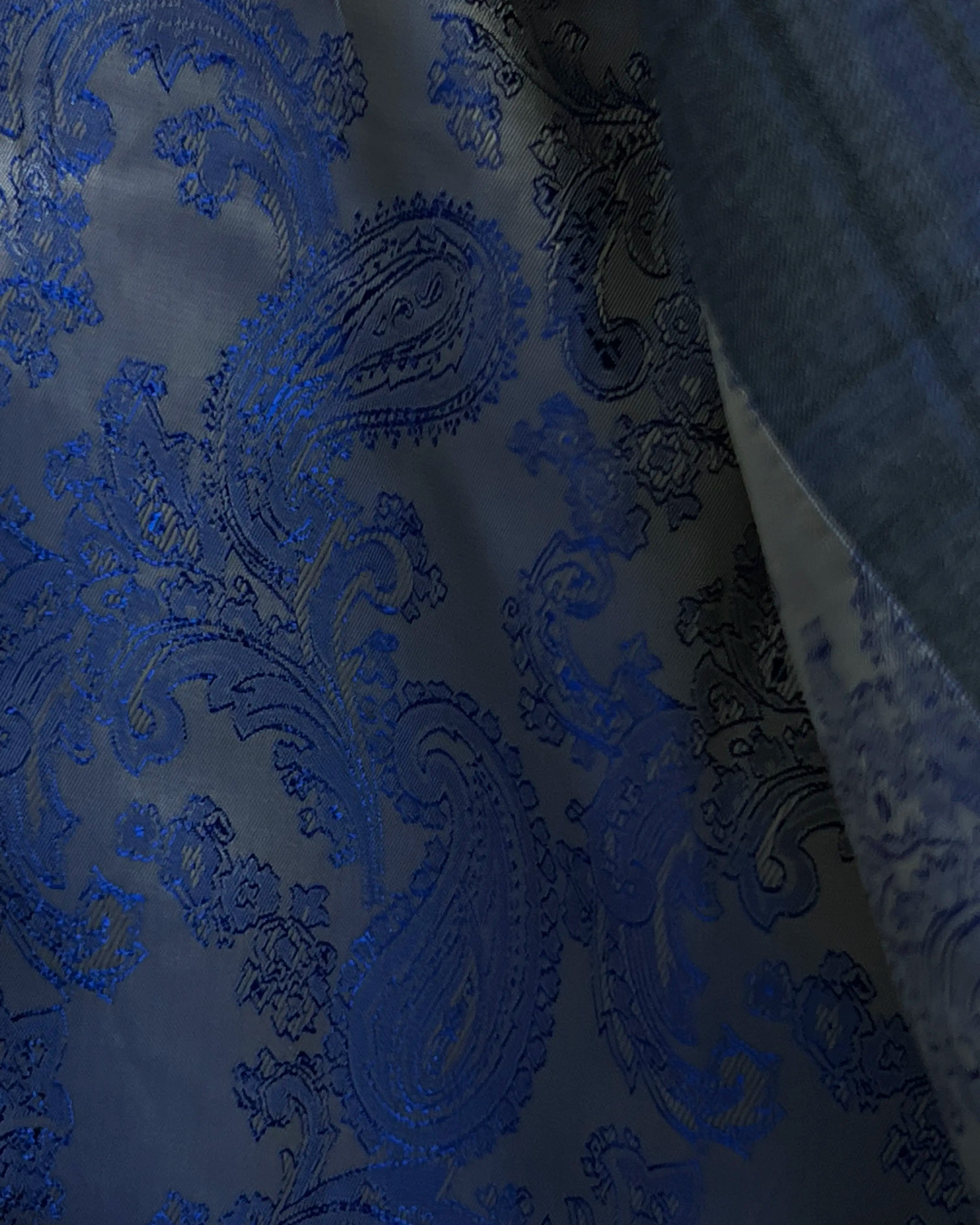 Interior view of charcoal grey royal blue windowpane men's sport coat showing paisley lining