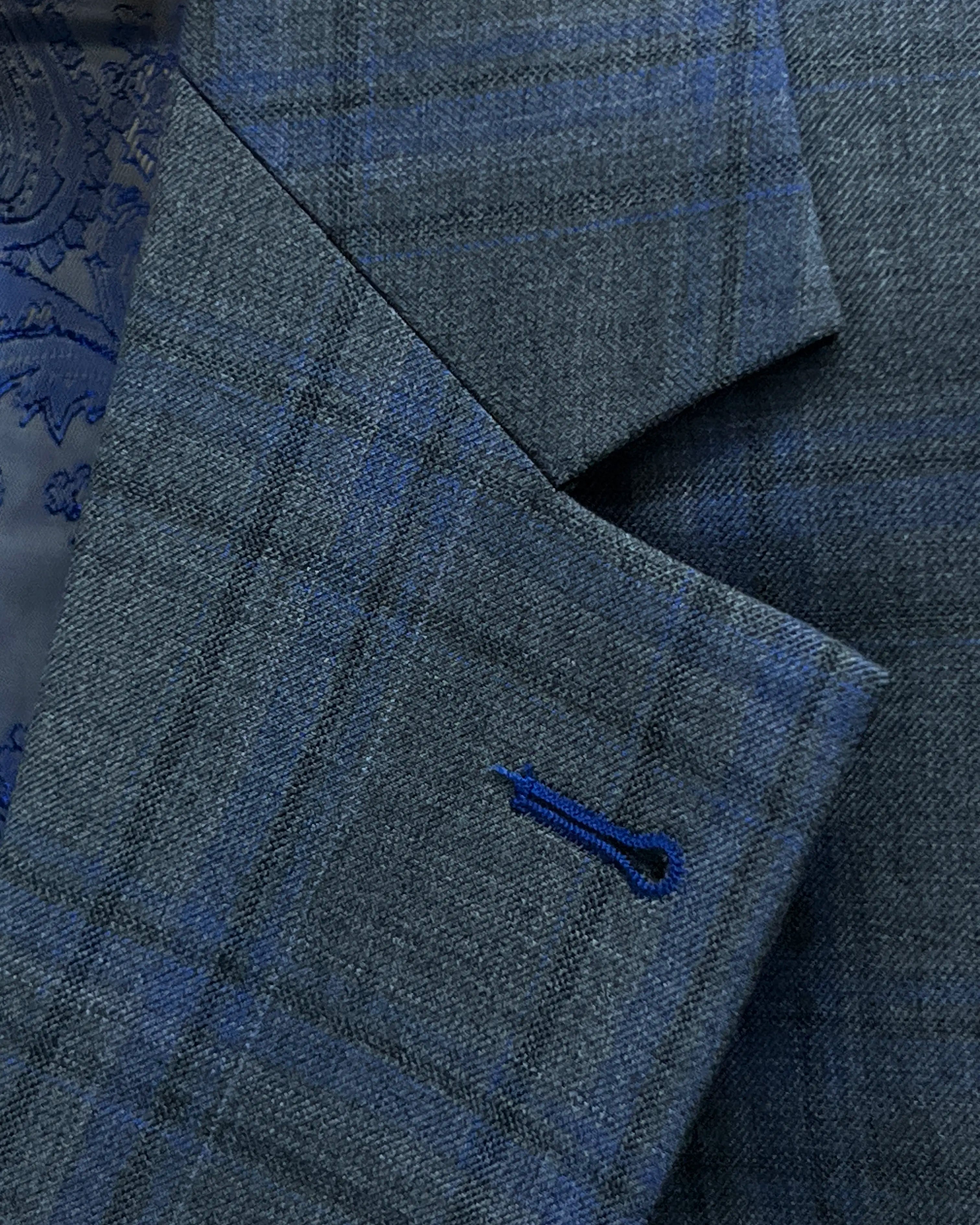 Lapel detail of charcoal grey royal blue windowpane men's sport coat showing royal blue buttonhole