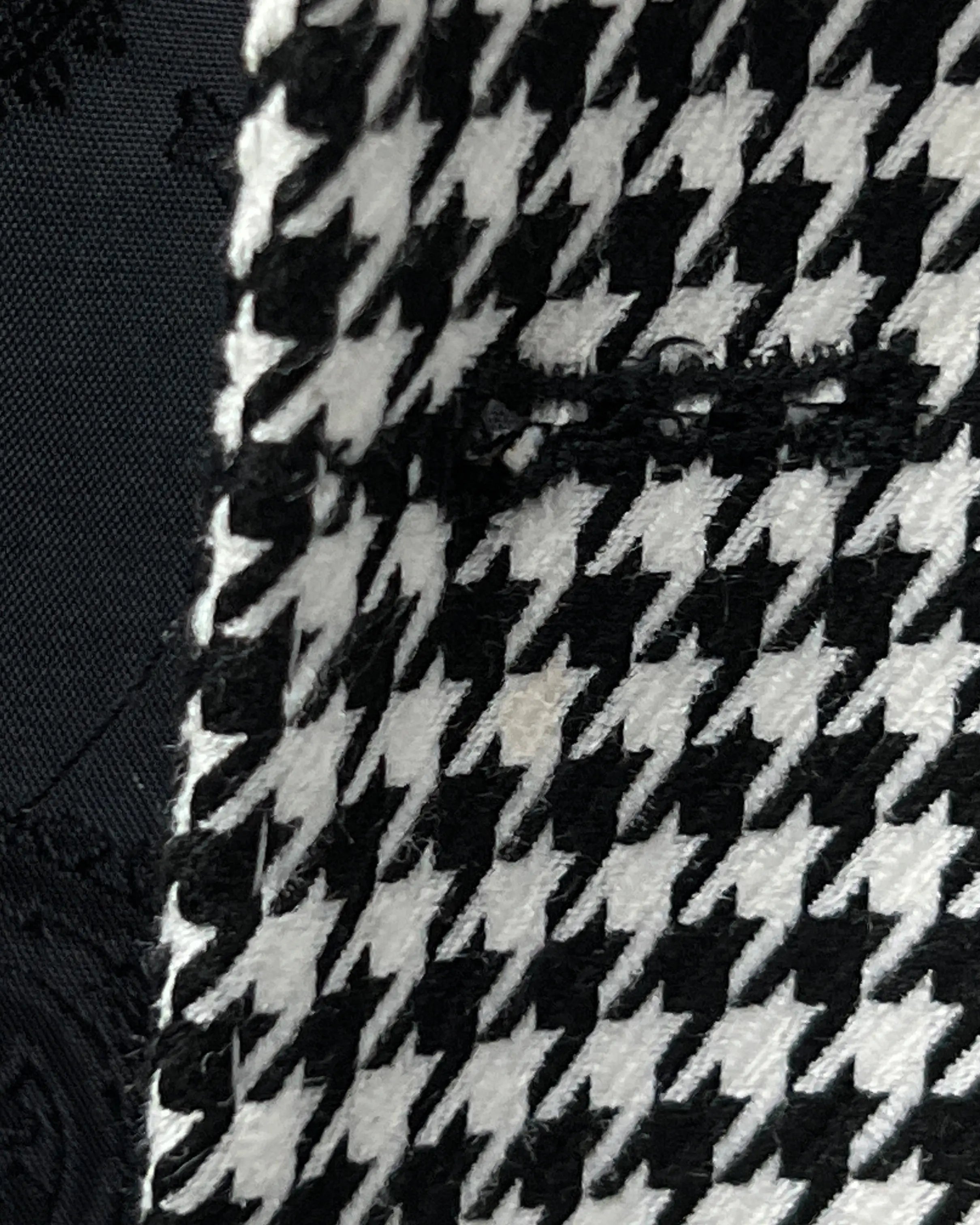 Front buttonhole close up of High Contrast Black and White Houndstooth men's sport coat showing clean tailored construction.