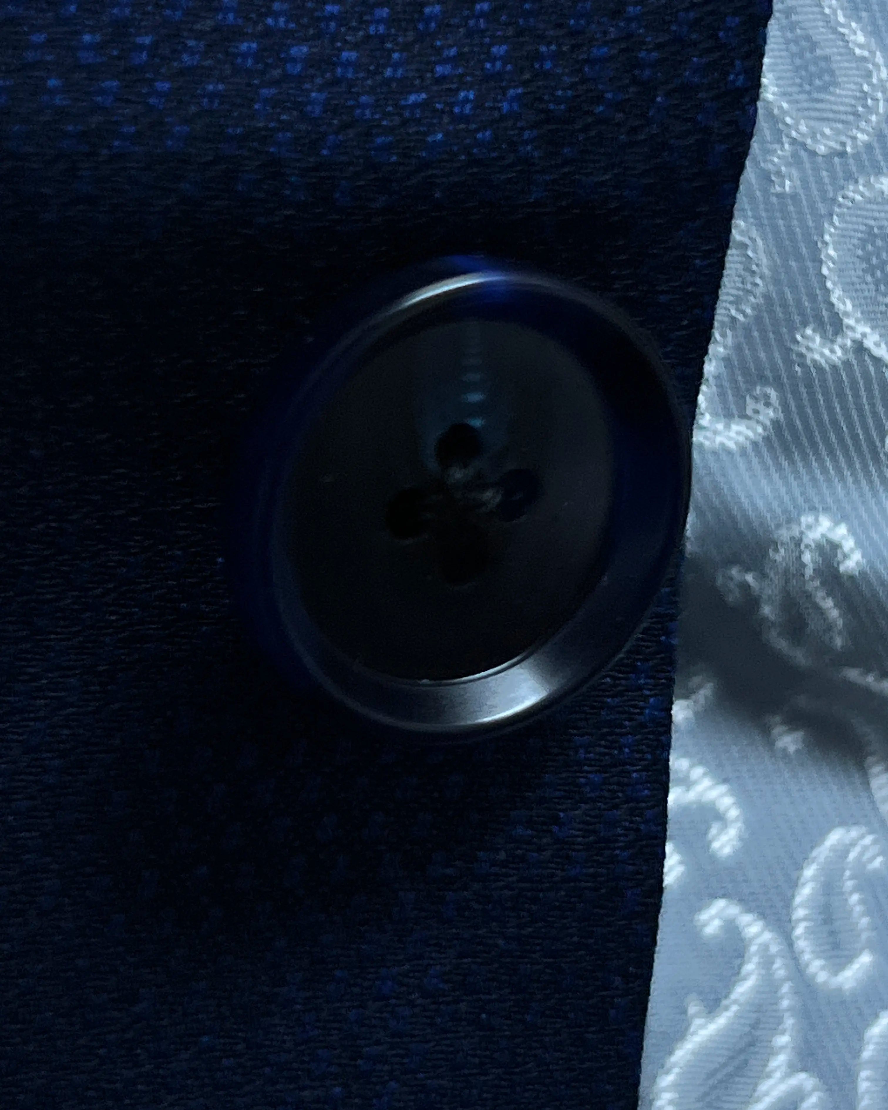Button close up of Royal blue Birdseye men's sport coat showing dark navy horn buttons