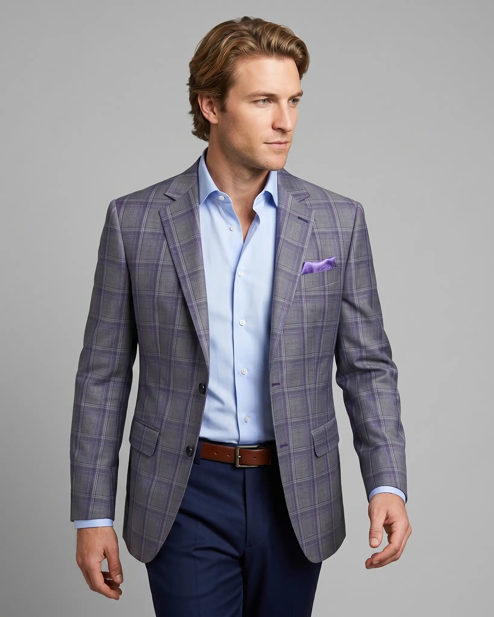 Angled model view of Steel Grey Windowpane men's sport coat showing the jacket drape, lapel roll, and natural lining glimpse.