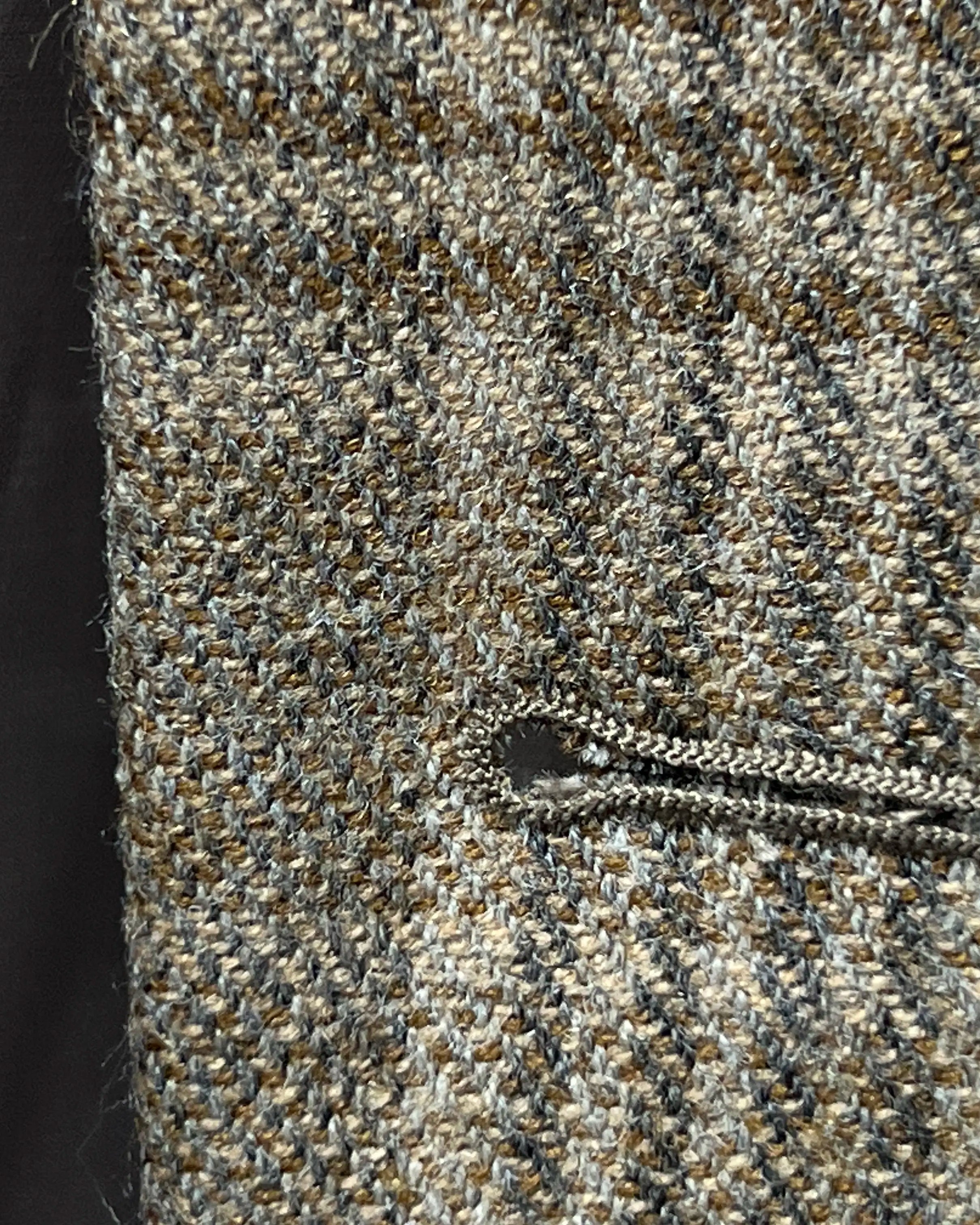 Front buttonhole detail of Warm Taupe Textured Check men's sport coat showing the main front buttonhole finish