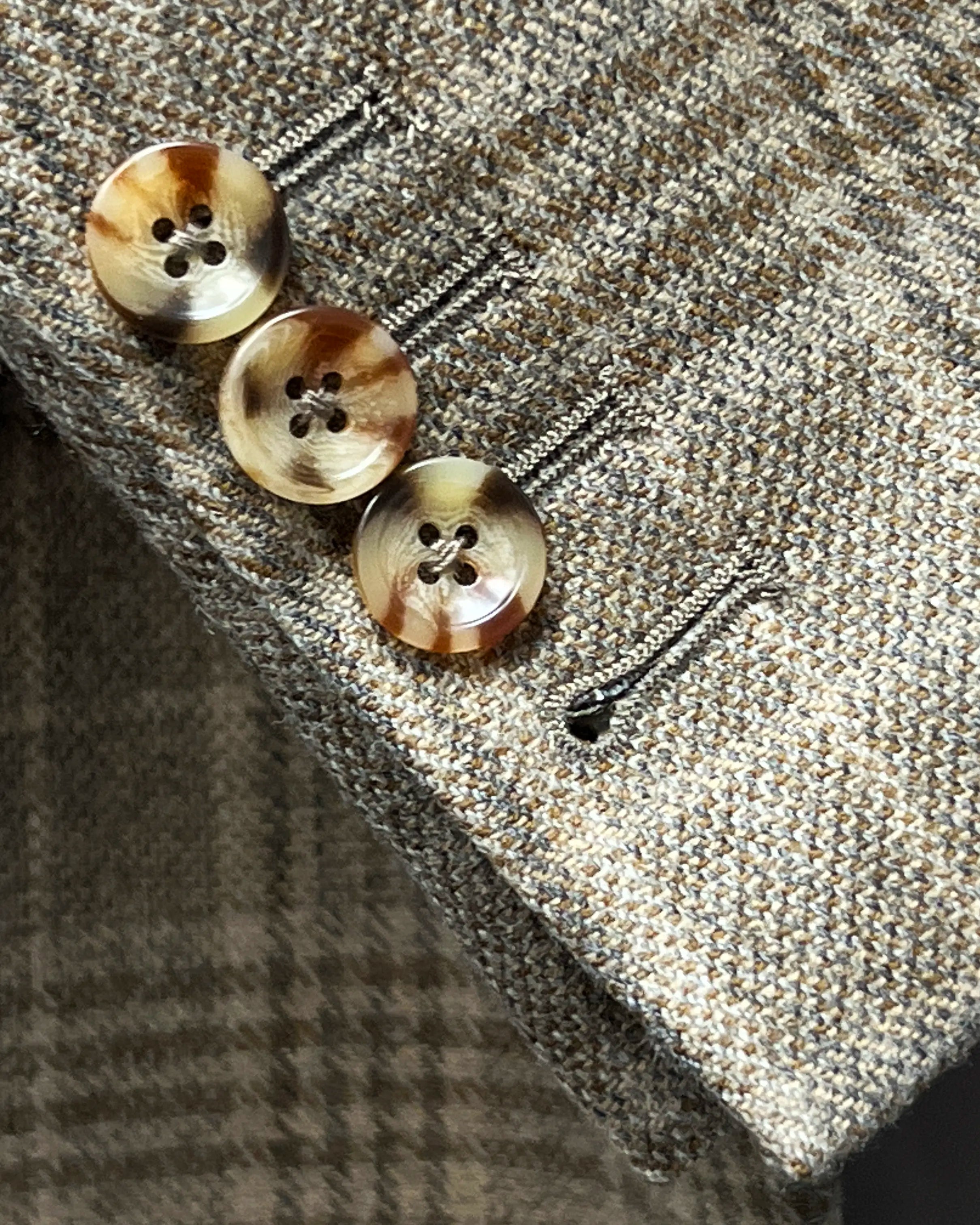 Sleeve cuff detail of Warm Taupe Textured Check men's sport coat showing functional sleeve buttons