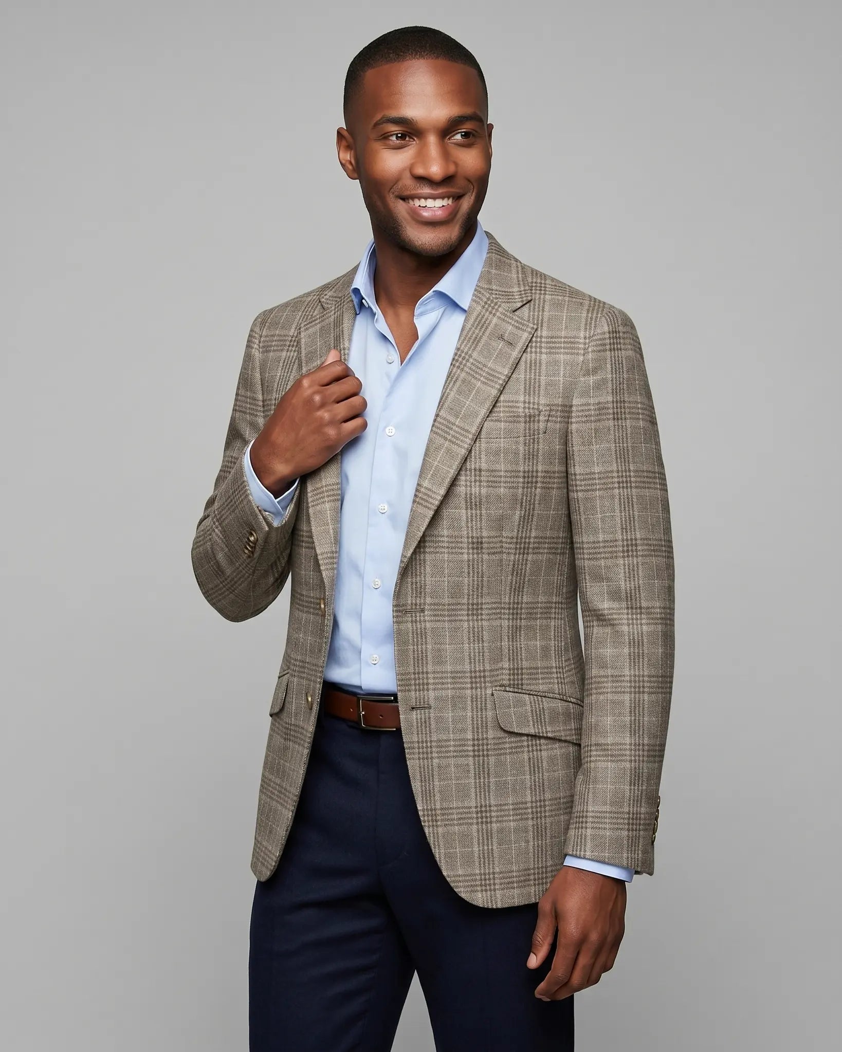 Angled model view of Warm Taupe Textured Check men's sport coat showing subtle lining glimpse and side profile