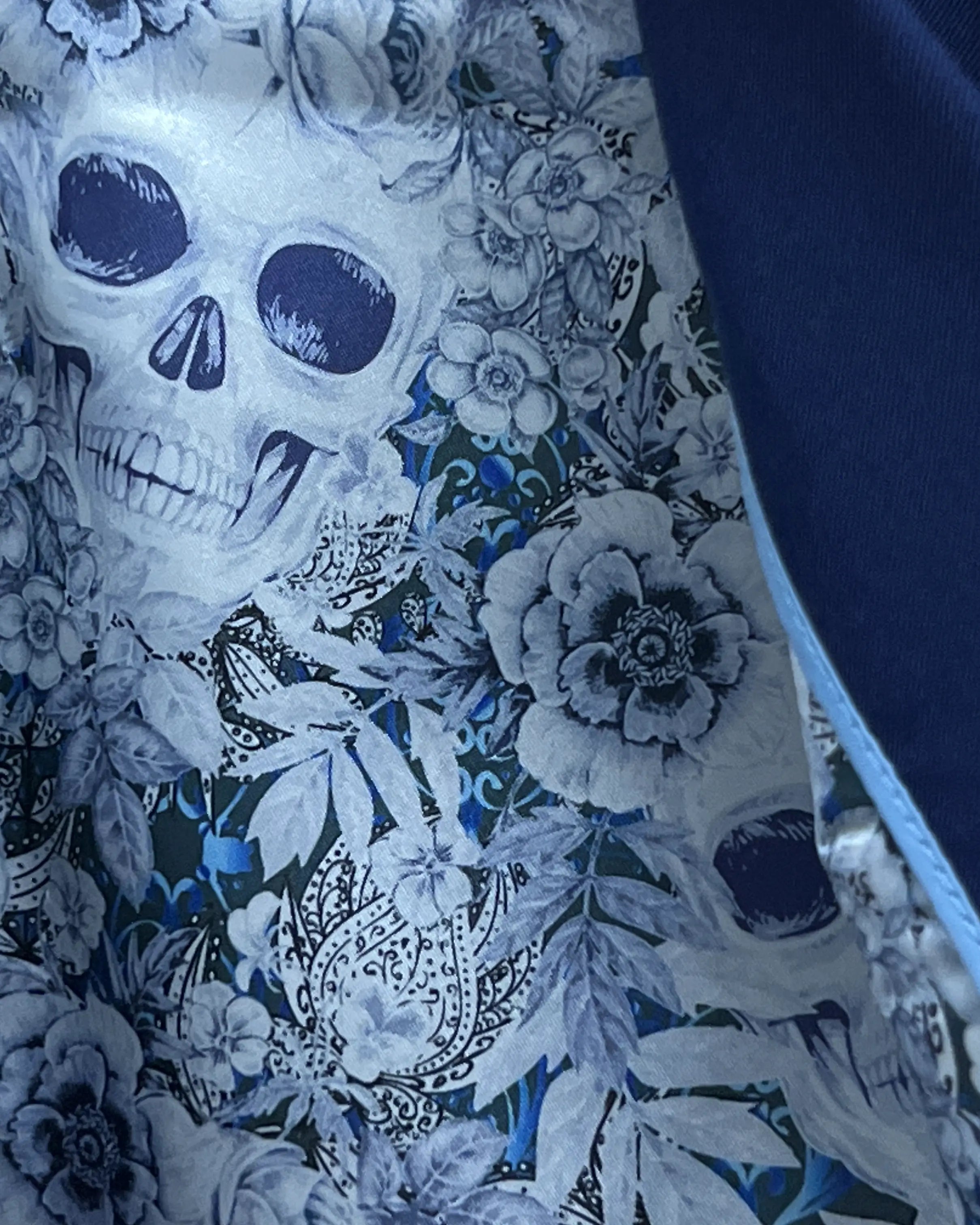 Interior lining close up of royal blue sharkskin men's suit showing the Blue Skulls Bemberg silk lining.