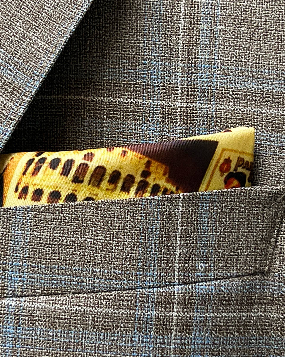 Breast pocket of tan blue windowpane sport coat with built-in pocket square holder and hand-finished edges
