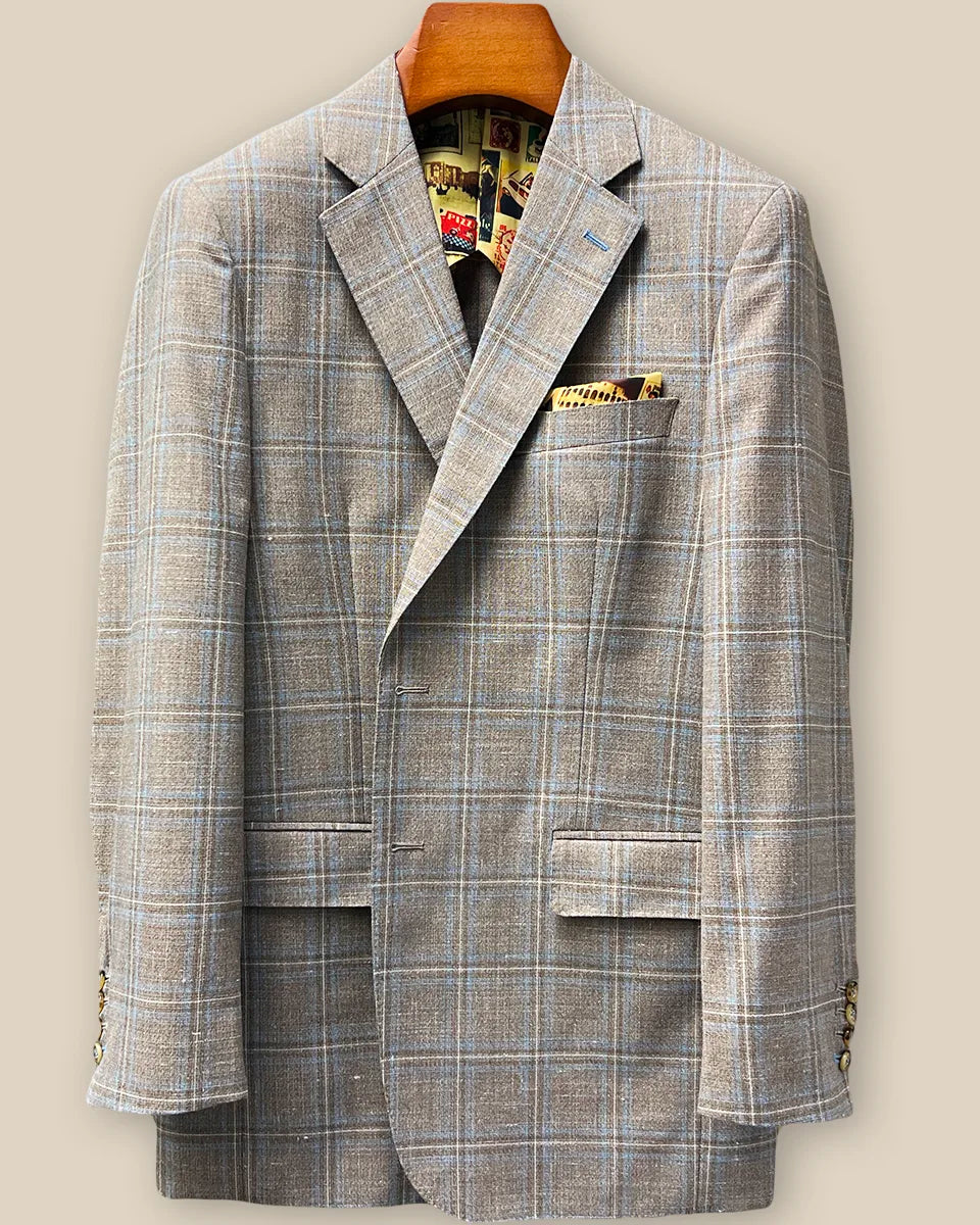 Close-up view of tan blue windowpane sport coat showing contrast sky blue accent buttonhole with hand-finished stitching detail