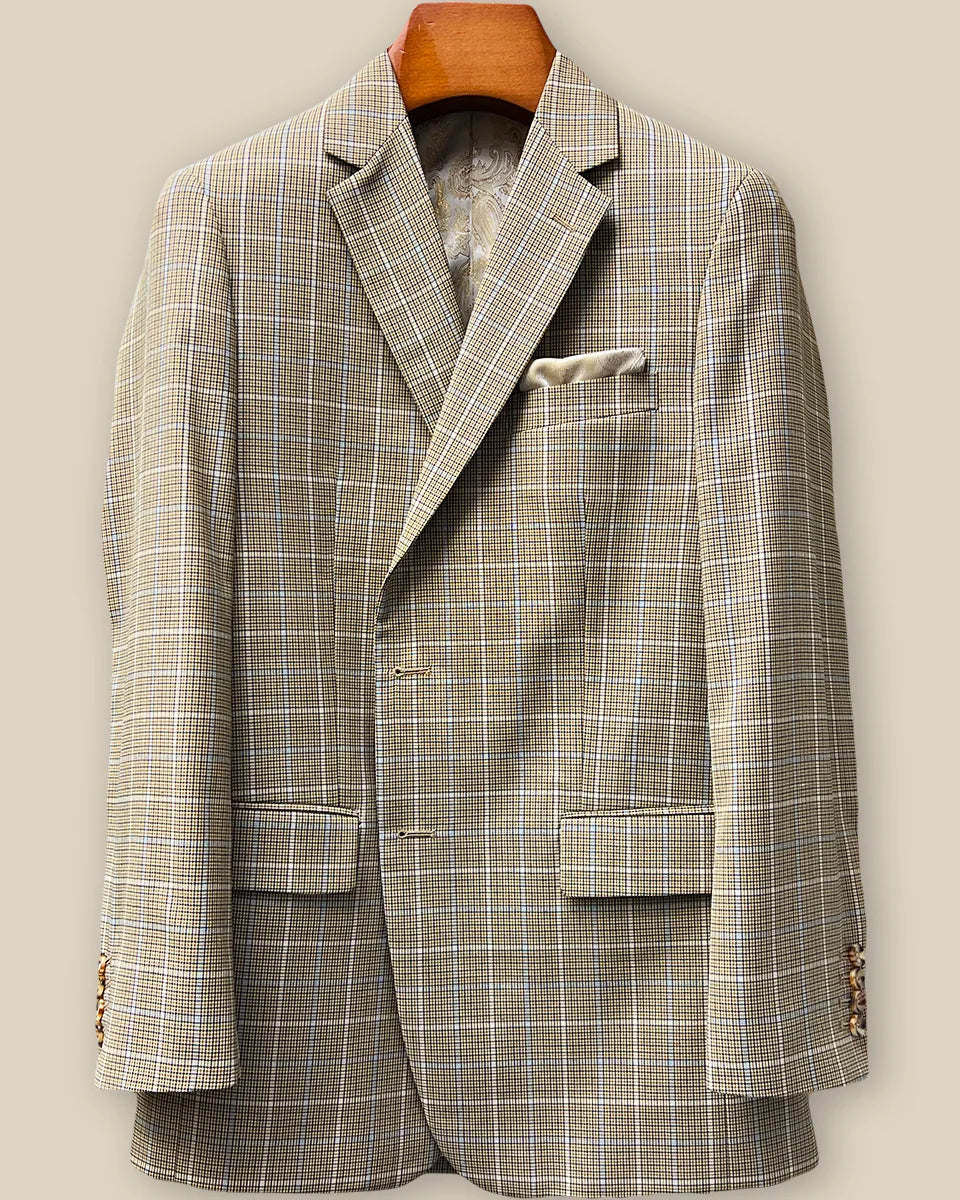 Close-up view of tan brown glen check sport coat jacket showing buttonhole panel with swirled caramel horn buttons