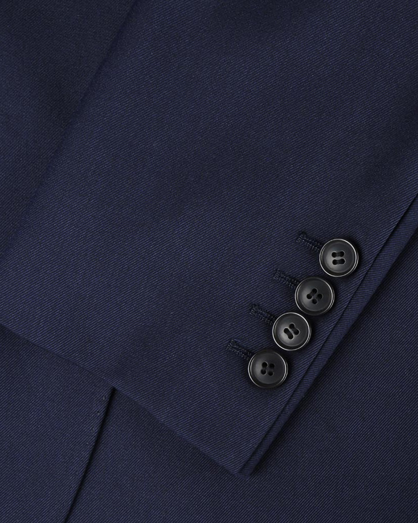 Plain weave navy custom suit, close-up of the sleeve cuffs and buttons for work attire