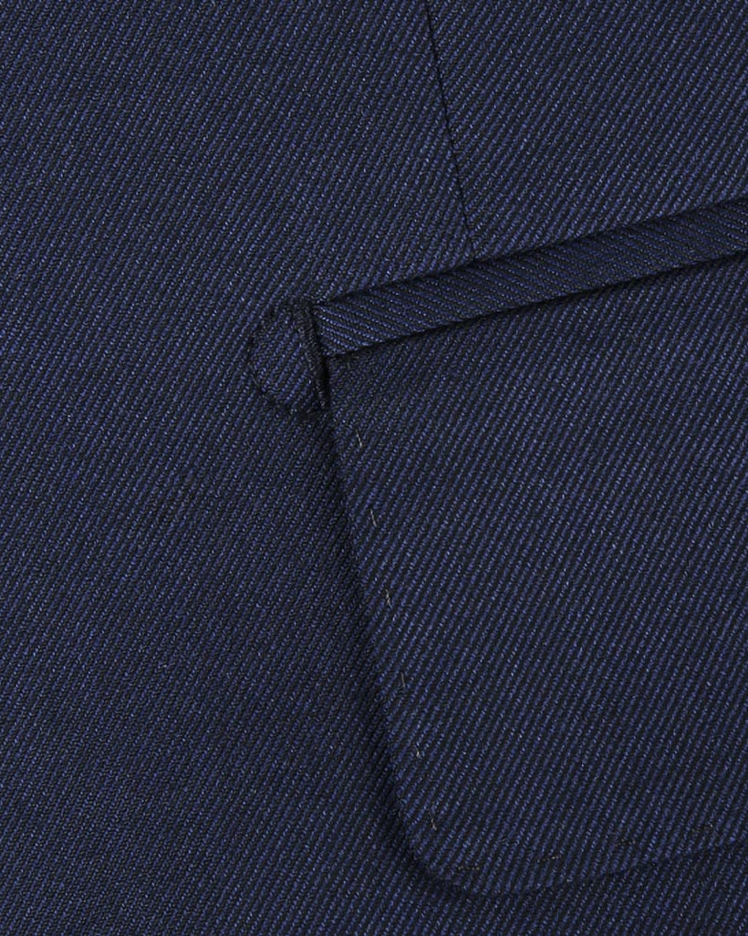 Close-up of the plain weave fabric on a navy custom suit for online design