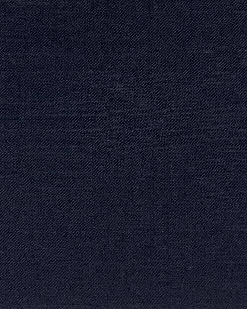 Close-up of the plain weave fabric on a navy custom suit for online design