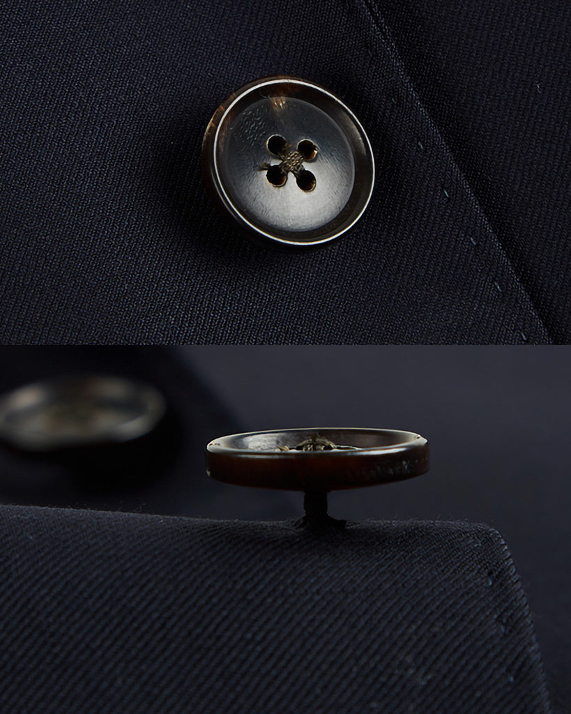 Men's custom tailored plain weave suit, side view highlighting the precise fit for work