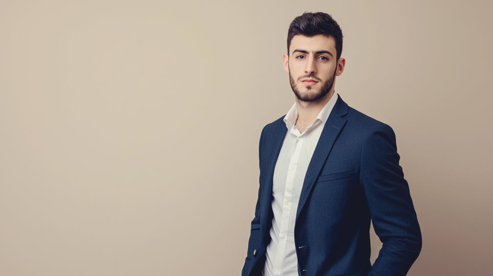 Single male model wearing classic navy winter suit demonstrating professional styling and fabric quality with natural shoulder construction and traditional tailoring details