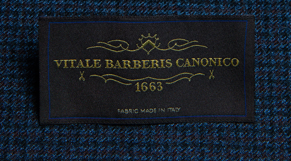 Close-up of Vitale Barberis Canonico Perennial fabric in navy blue showing twill weave and rich colour