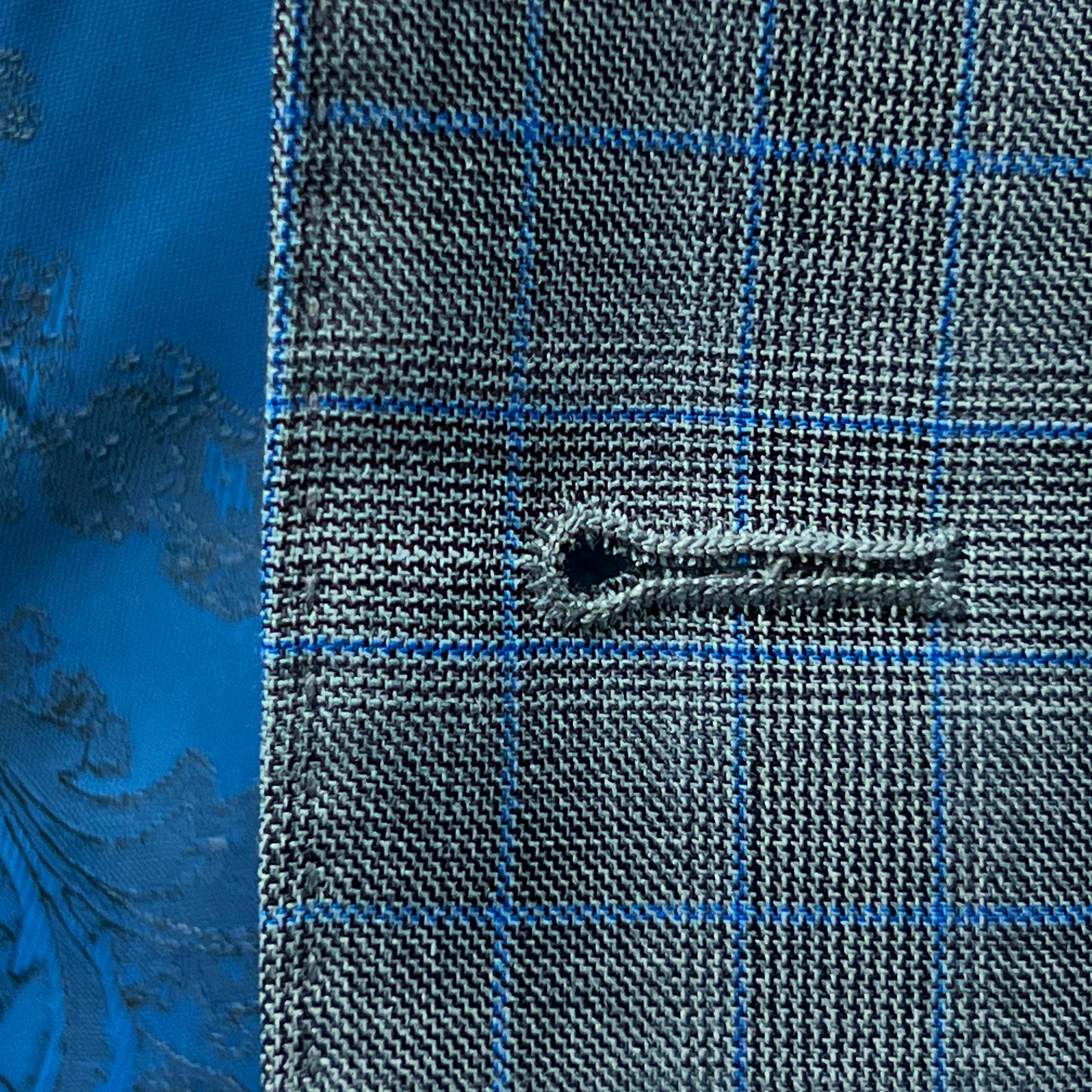 Glen plaid suit by Westwood Hart, highlighting tailored perfection.