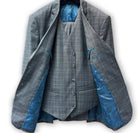 Blue check suit pattern with intricate detailing.