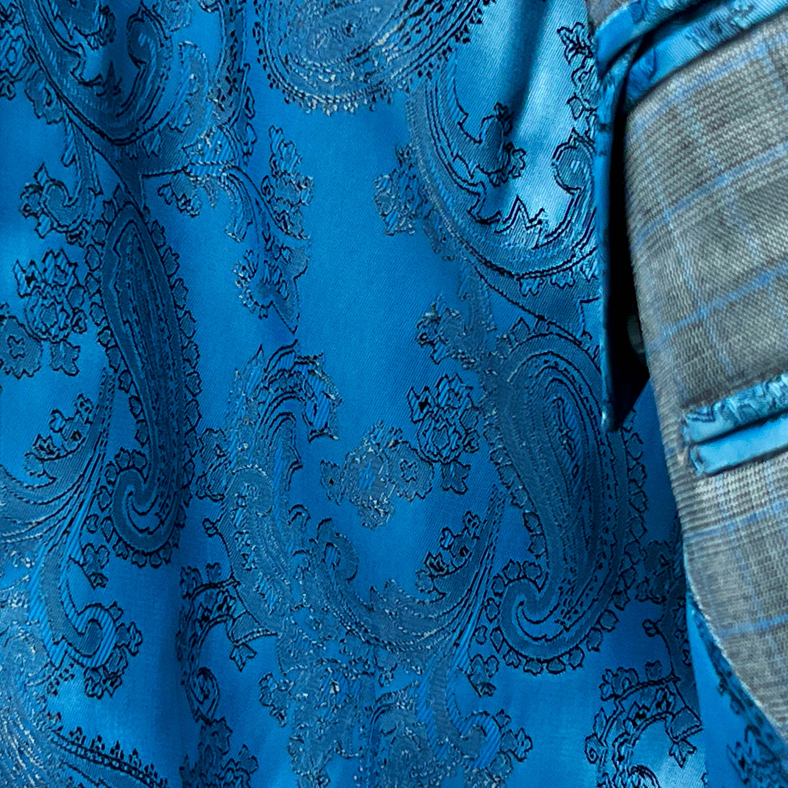 Suit drape showcasing gray check suit casual elegance.