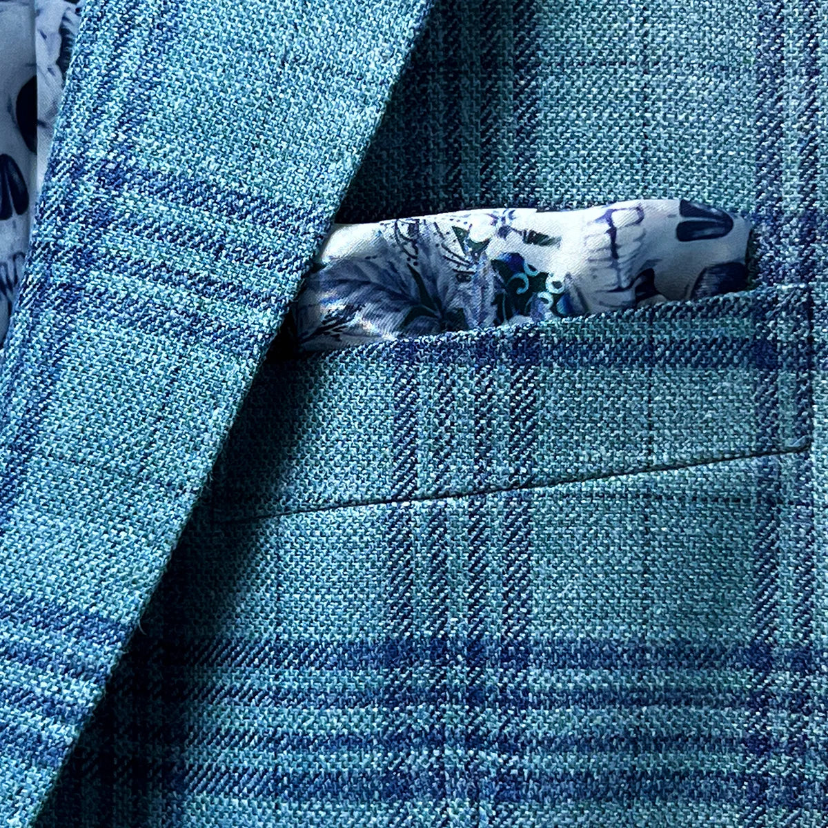 View of the men's sportcoat's built-in pocket square in skull blue lining.