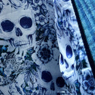 Interior view showing the men's sportcoat's flash linings in blue and white rose and skull design.