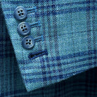 Close-up of the men's sportcoat's functional sleeve buttonholes with dark blue accent stitching.