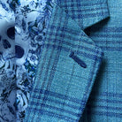 Close-up of the men's sportcoat's notch lapel with AMF pick stitching and dark blue accent buttonhole.