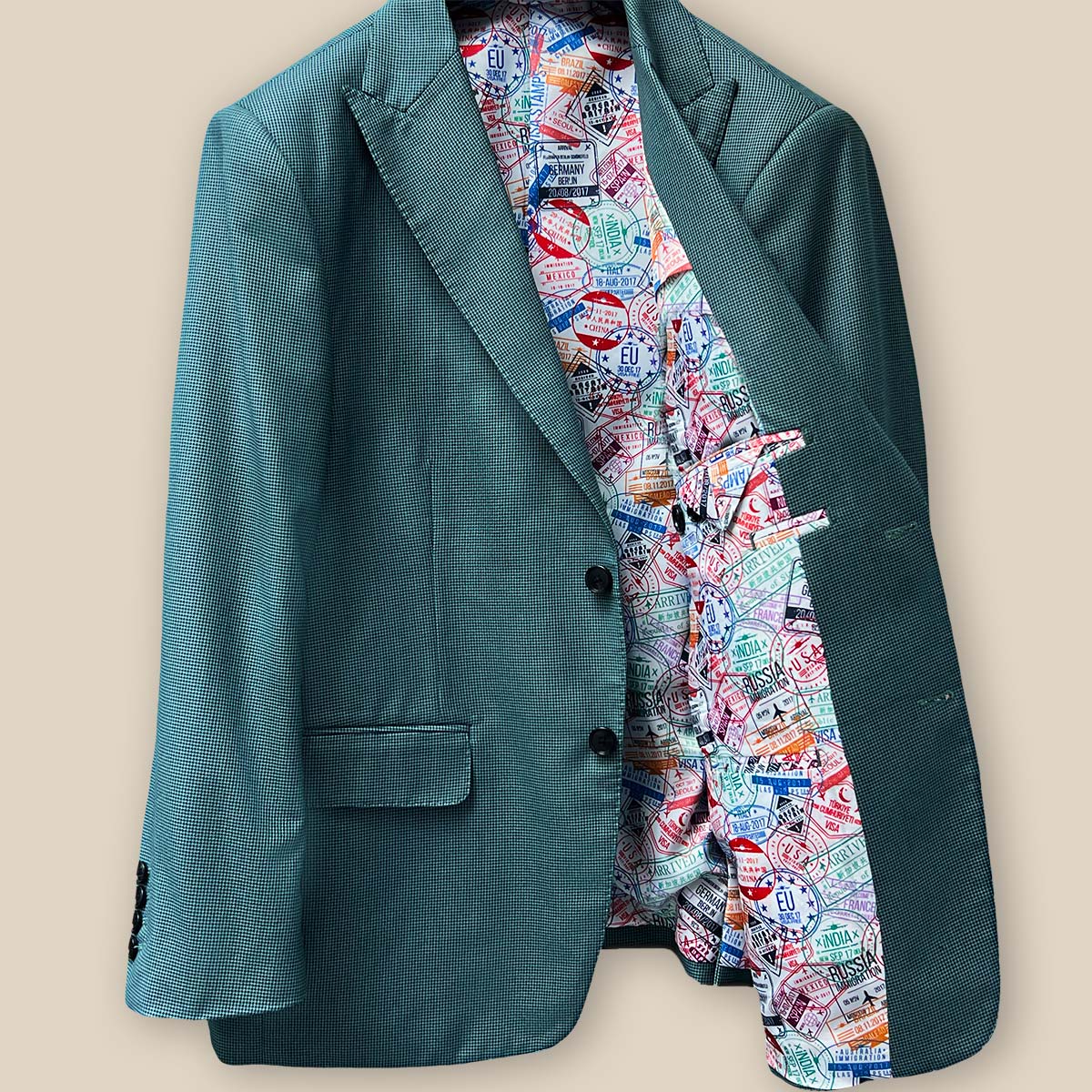 Elegant horn buttons on a hunter green sportcoat.