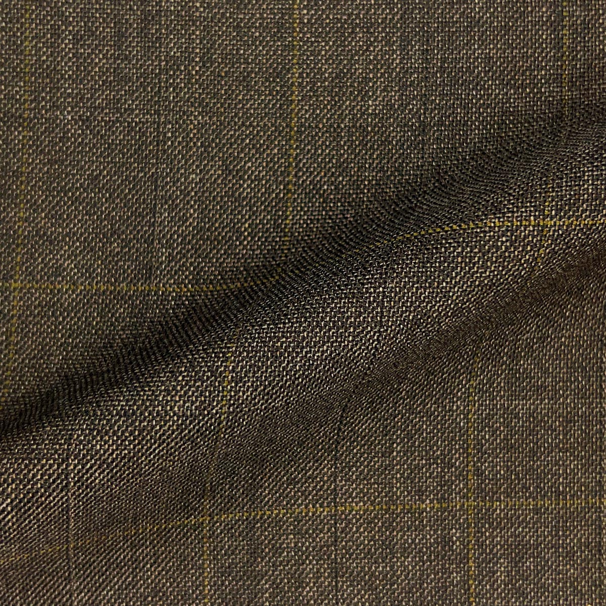 Custom suits by Westwood Hart featuring luxurious bamboo fabric in medium brown and light brown windowpane.